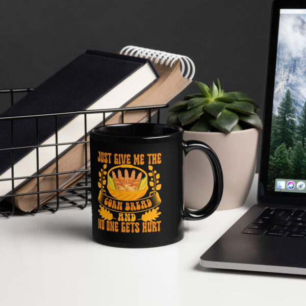 black-glossy-mug-black-11-oz-handle-on-right-68f3f90e32f28.jpg